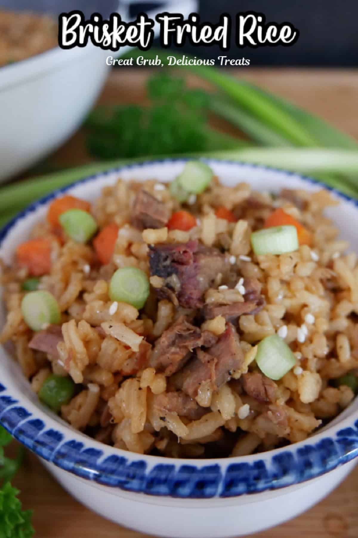 A white bowl with blue trim filled with a serving of brisket fried rice with a title overlay at the top.