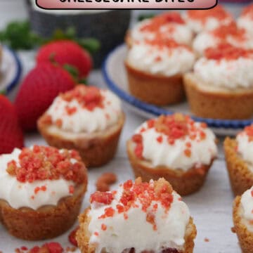 A white surface with bite-size mini strawberry cheesecake bites on it with a title overlay at the top.