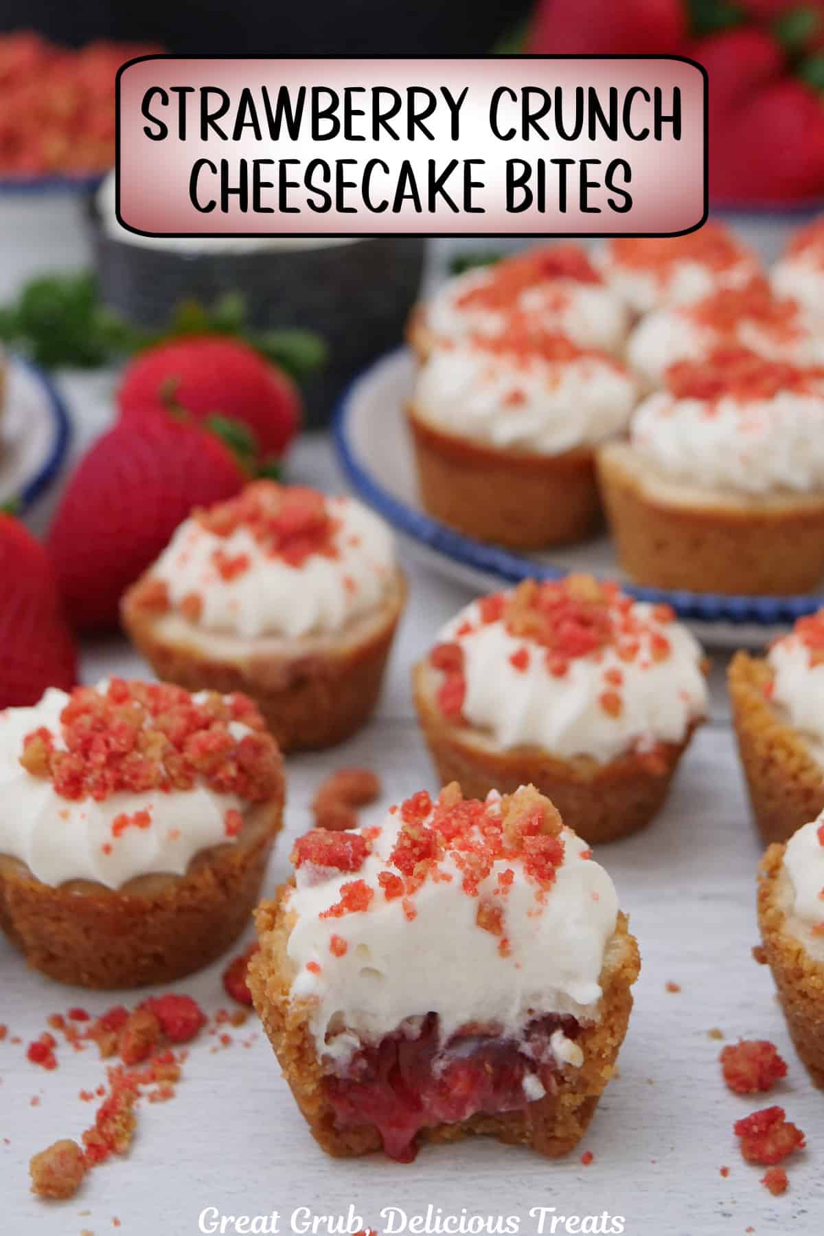 A white surface with bite-size mini strawberry cheesecake bites on it with a title overlay at the top.