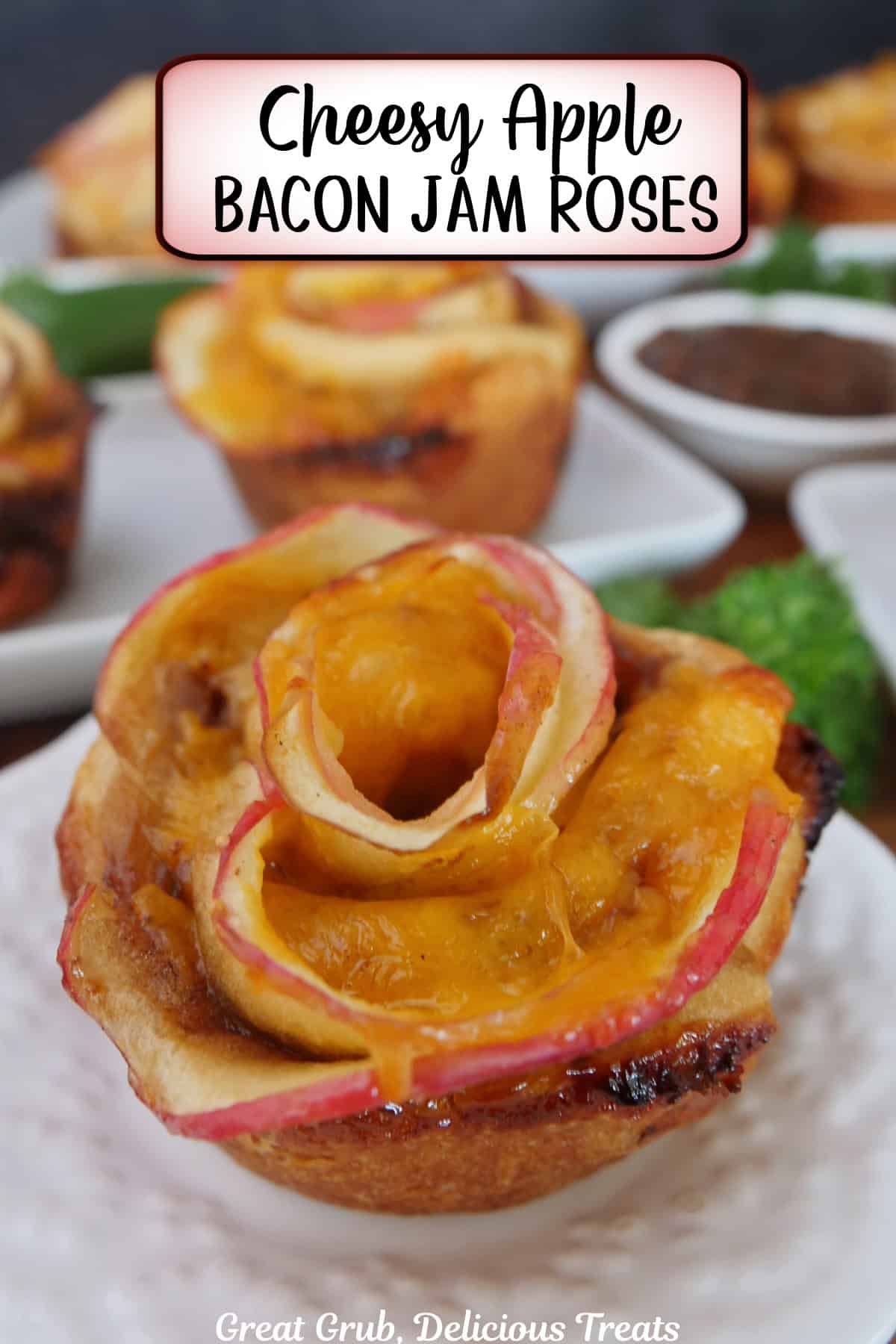 A small round white plate with a apple pastry rose on it with a title overlay at the top.