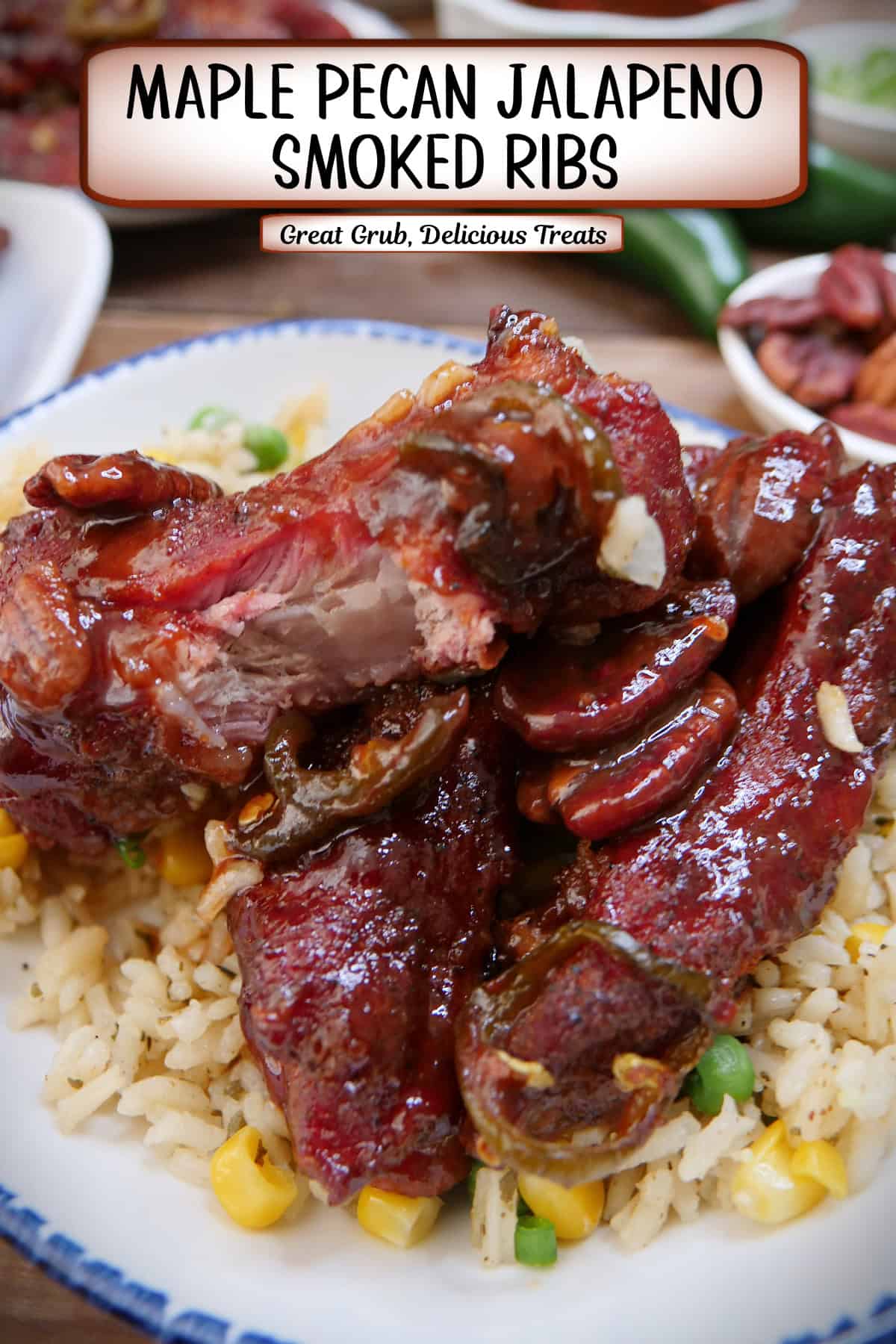 A white plate with blue trim with three maple pecan smoked ribs on a bed of vegetable rice, and a title overlay at the top.