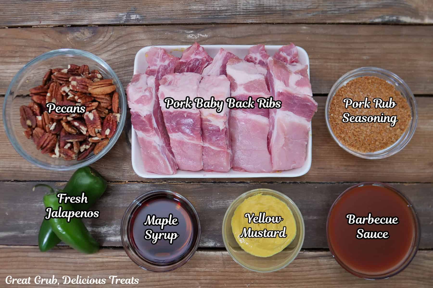 A wood surface with all the ingredients placed on it to make maple pecan jalapeno smoked ribs.