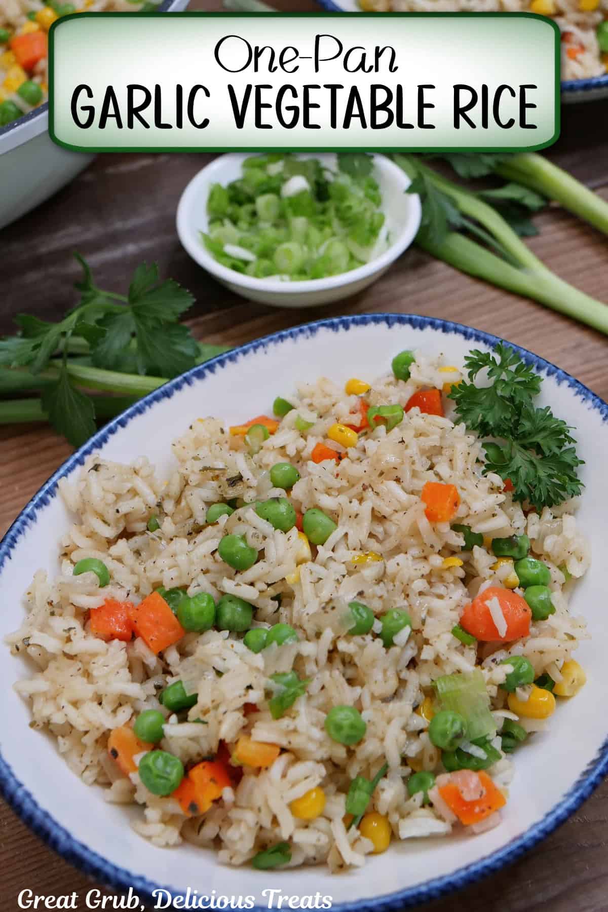 A white bowl with blue trim filled with a serving of garlic vegetable rice with a title overlay at the top.