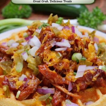 A round white plate with blue trim with a cornbread waffle on it piled high with leftover pulled pork, cheese, onions, crispy fried onions, and drizzled with BBQ sauce, and a title overlay at the top.