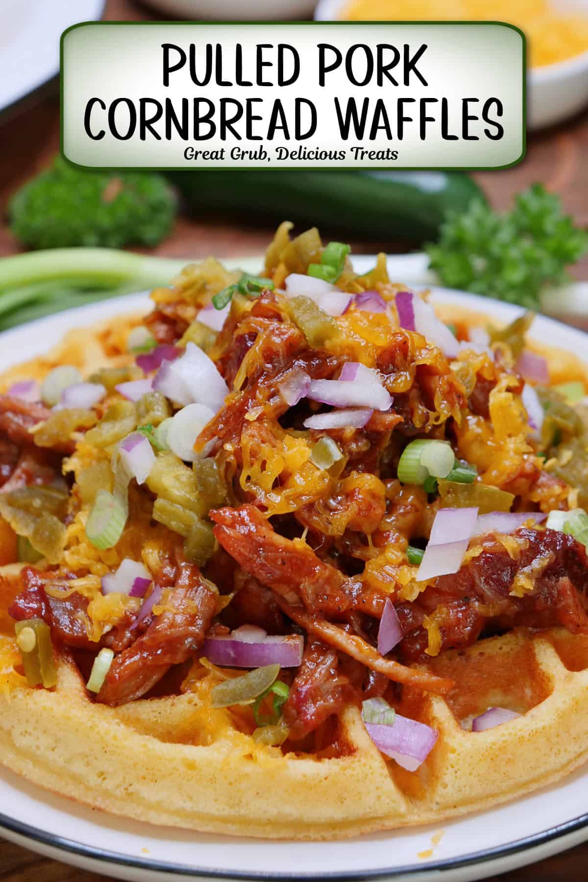 A round white plate with blue trim with a cornbread waffle on it piled high with leftover pulled pork, cheese, onions, crispy fried onions, and drizzled with BBQ sauce, and a title overlay at the top.
