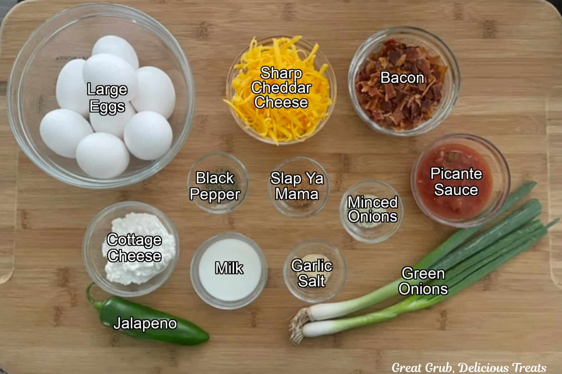 A wood surface with all the ingredients placed on it to make cheesy egg bites.