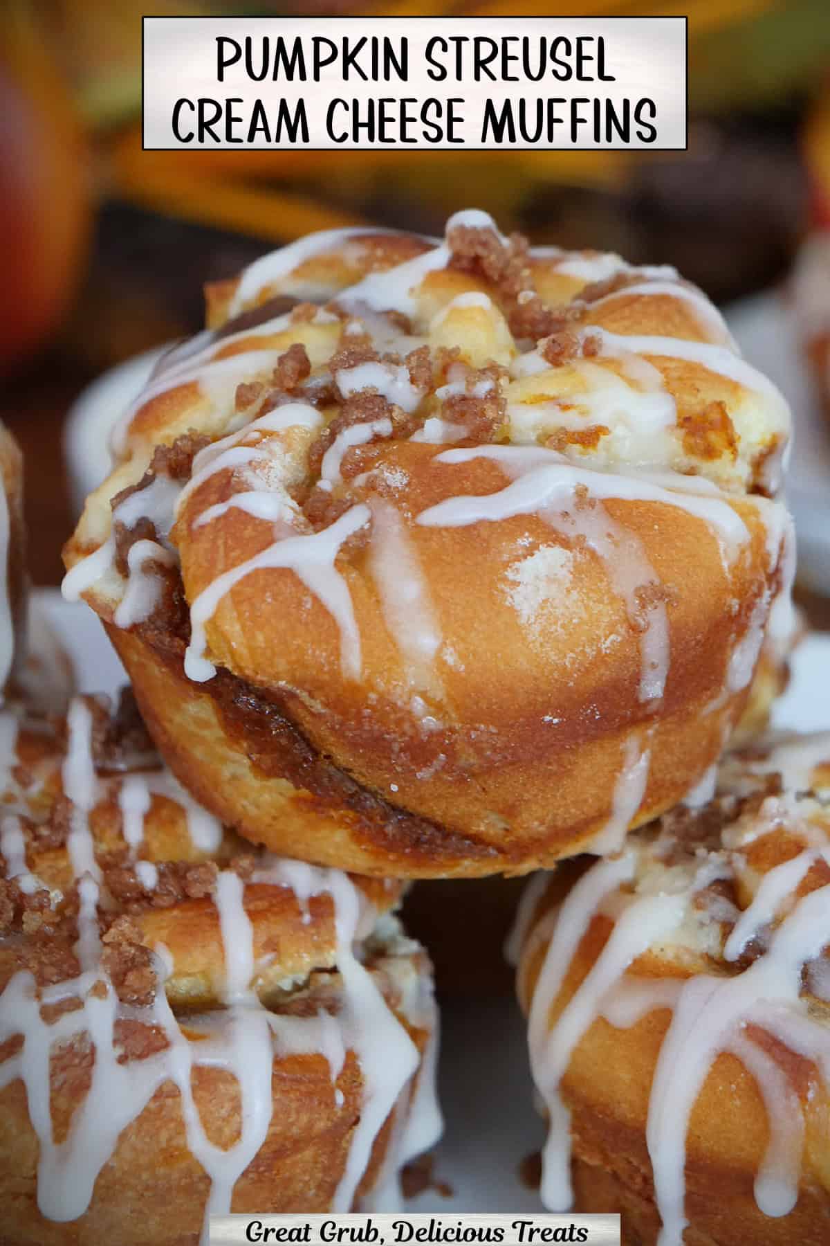 Three pumpkin streusel cream cheese muffins with a title overlay at the top.