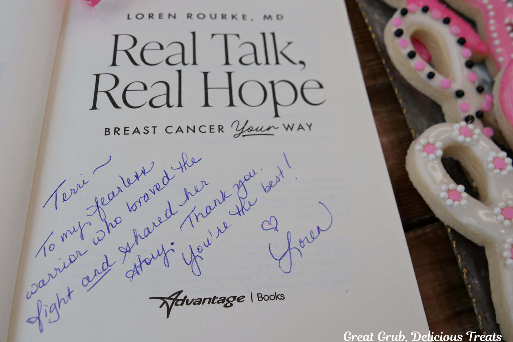 A personalized message from Dr. Loren Rourke to one of the "Warriors" in the Real Talk, Real Hope book with ribbon sugar cookies in the background.
