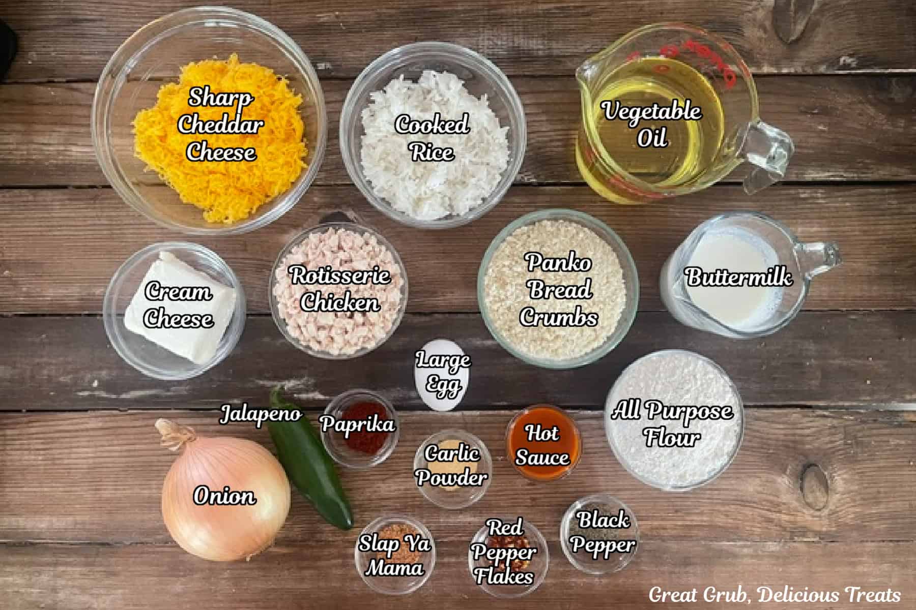 A wood surface with all the ingredients needed to make cheesy chicken rice bites placed on it.
