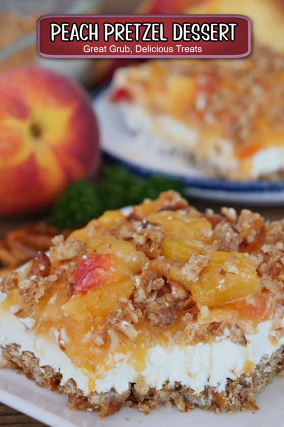 A serving of peach pretzel dessert on a white plate with another slice and a peach in the background, and a title overlay at the top.