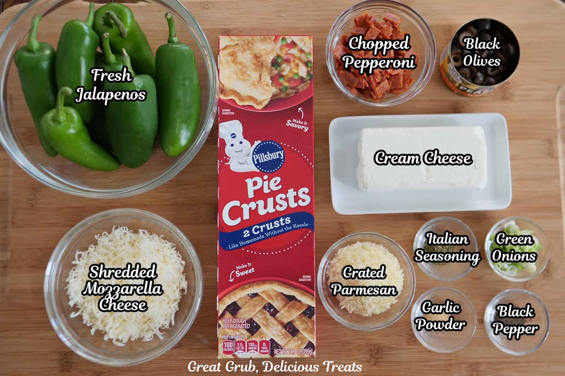 A wood surface with all the ingredients placed on it to make pepperoni pizza jalapeno poppers.
