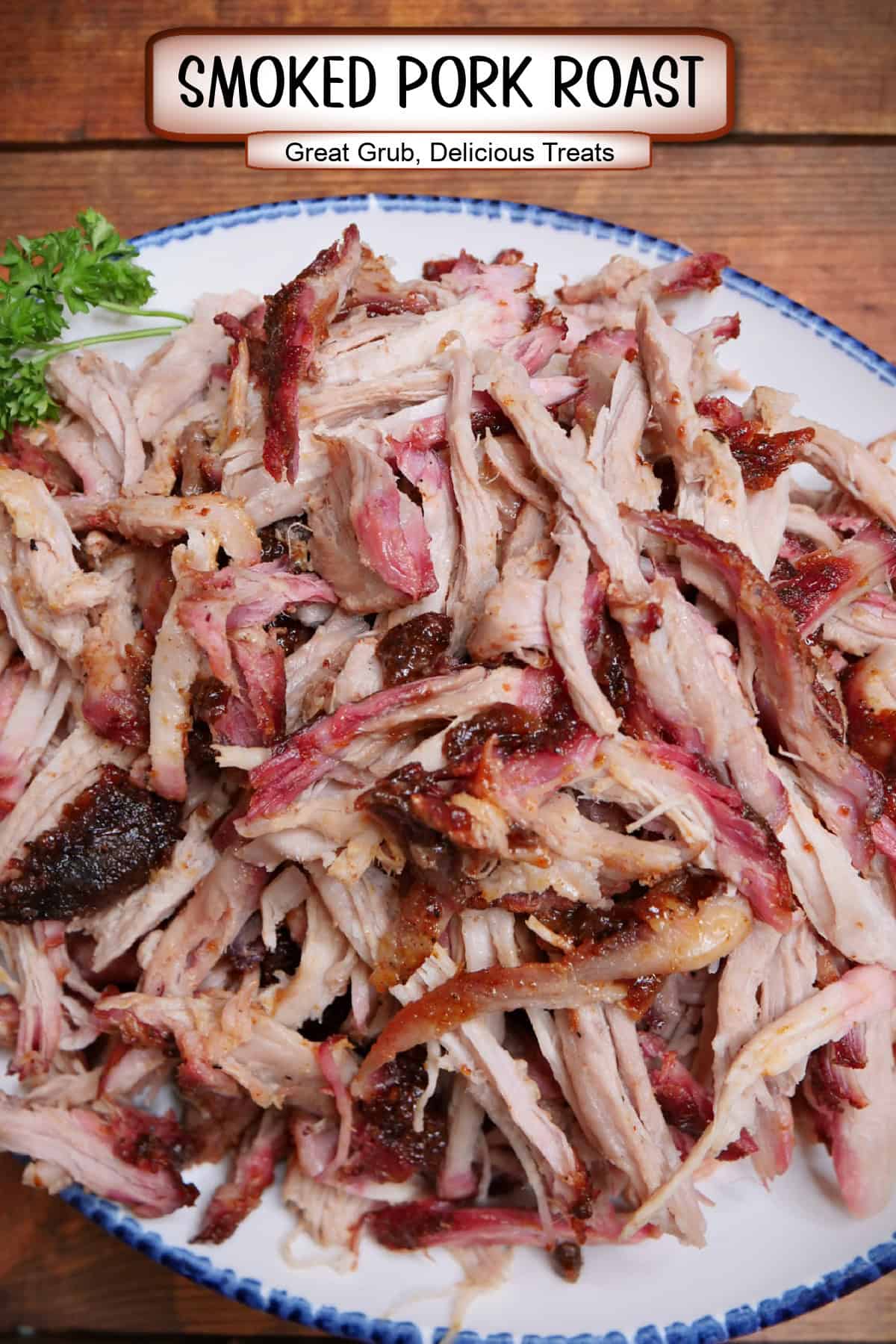 A white plate with blue trim with shredded smoked pork roast on it and a title overlay at the top.