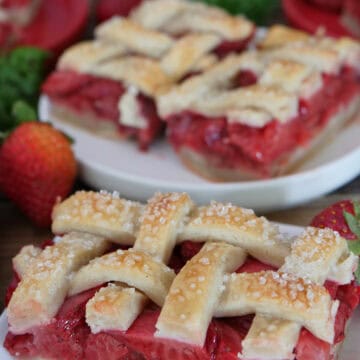 Strawberry pie bars on white plates with lattice pie topping, and a title overlay at the top.