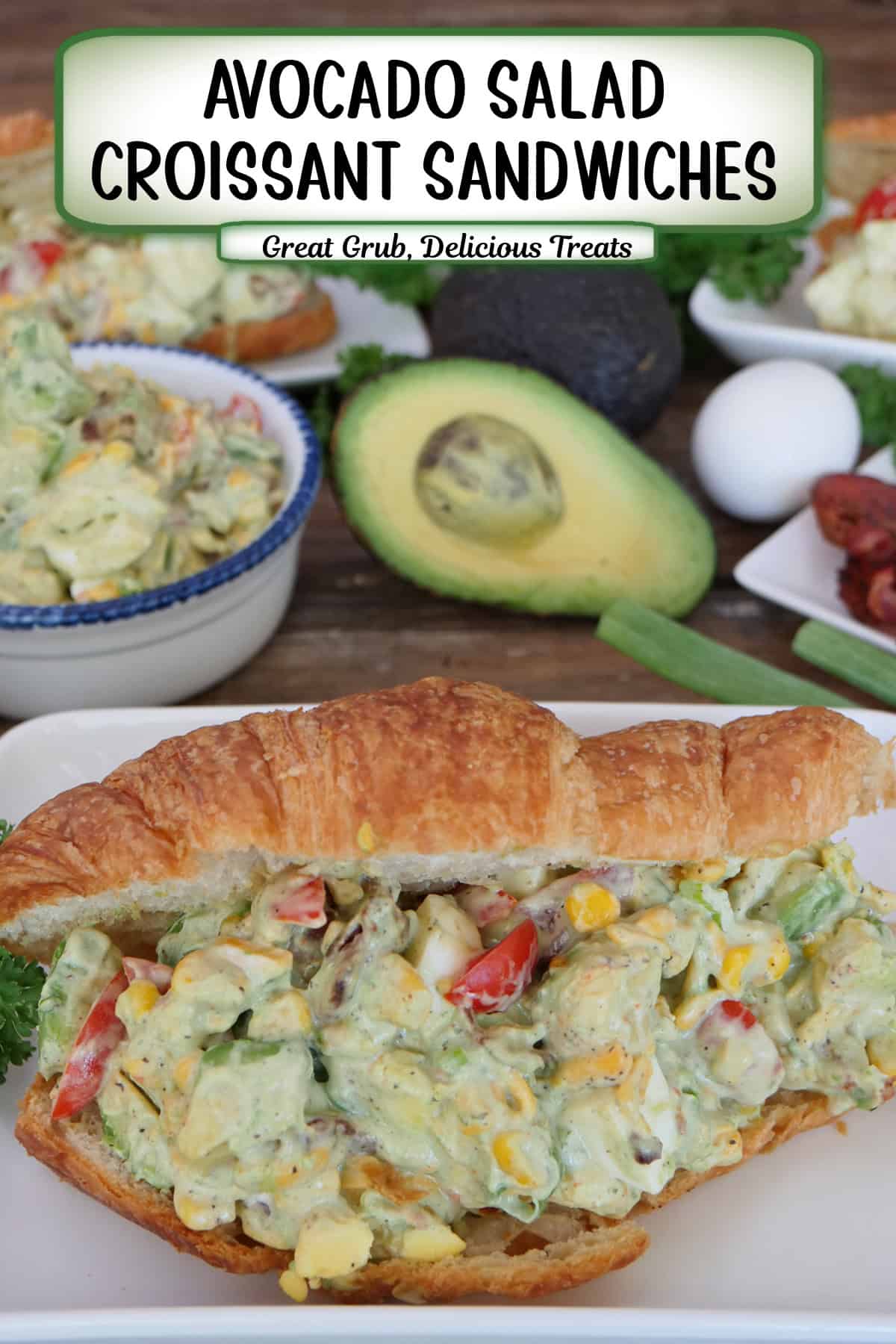A white plate with a buttery croissant filled with avocado salad, and a title overlay at the top.