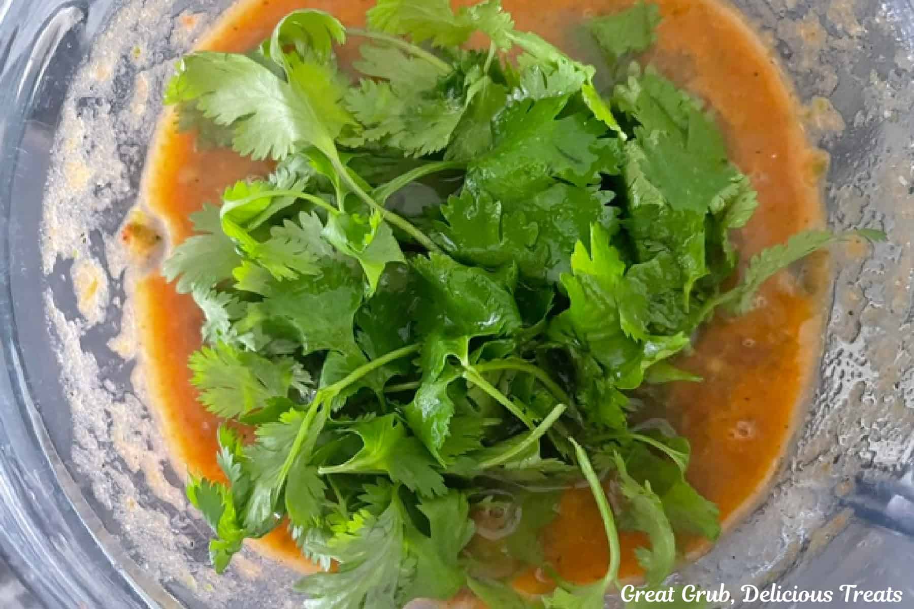Cilantro leaves added to the blended habanero salsa.