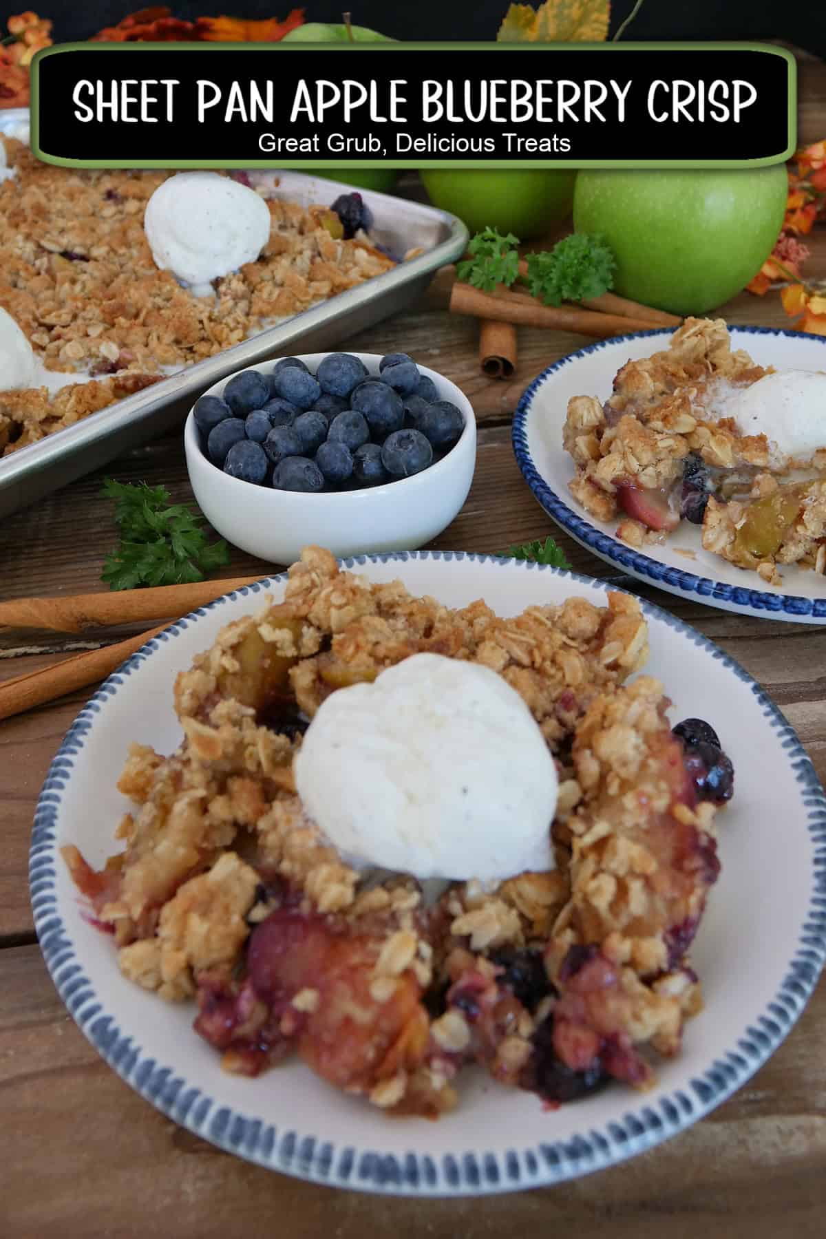 A round white plate with blue trim with a serving of apple blueberry crisp on it with a title overlay at the top.