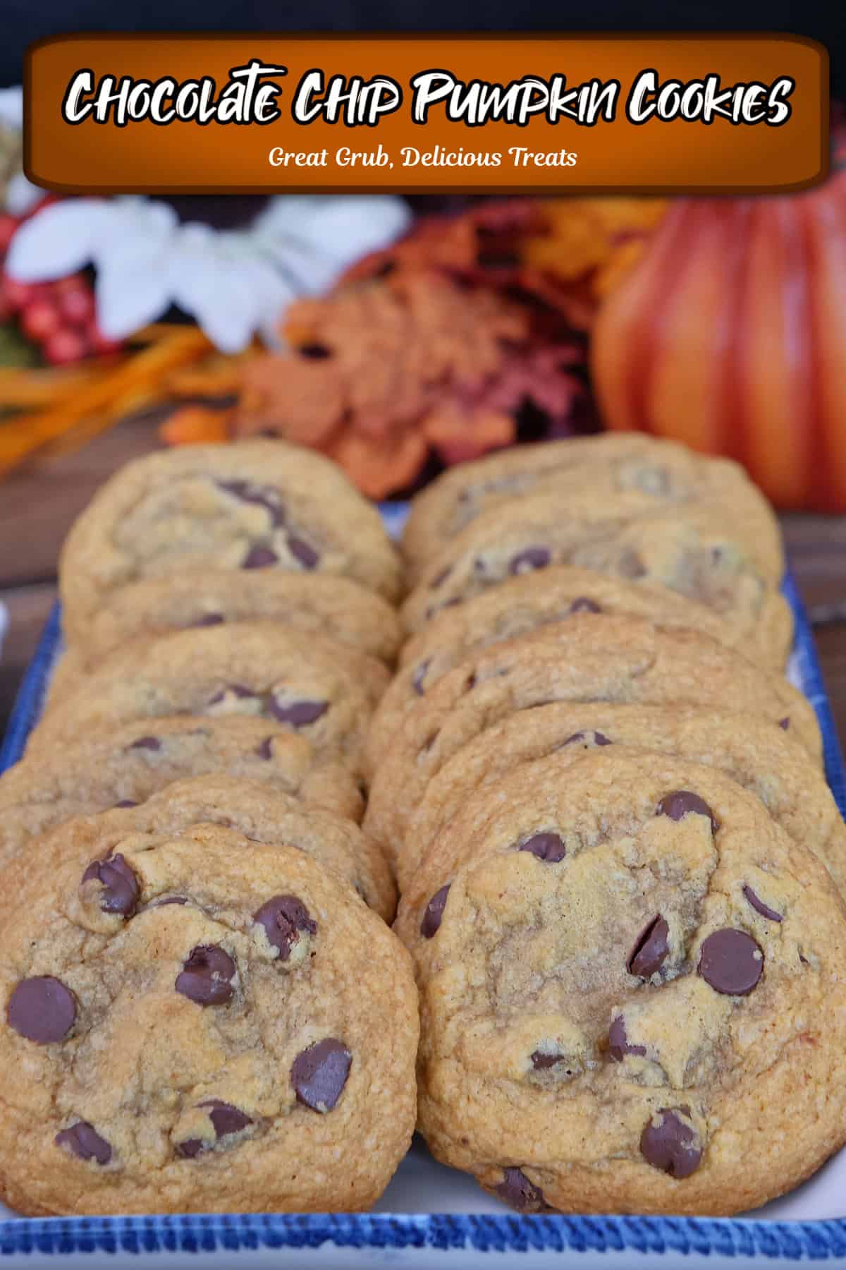 A dozen chocolate chip pumpkin cookies on a plate with fall foliage in the background, and a title overlay at the top.