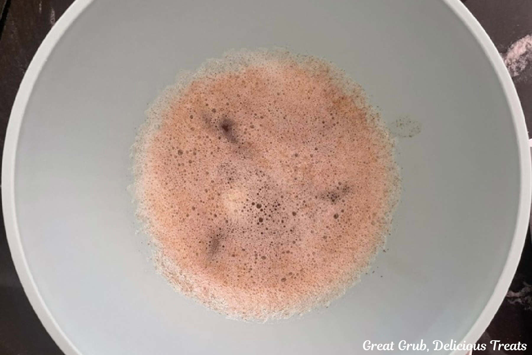 A mixing bowl with browned butter cooling off in it.