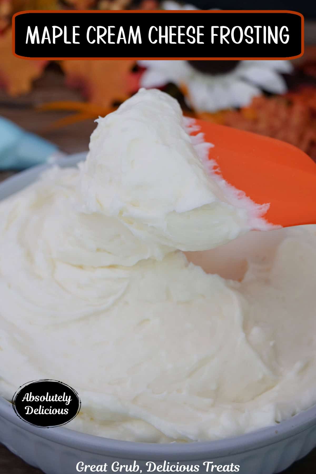 A light blue bowl filled with maple cream cheese frosting and an orange spatula scooping out some frosting, and a title overlay at the top.