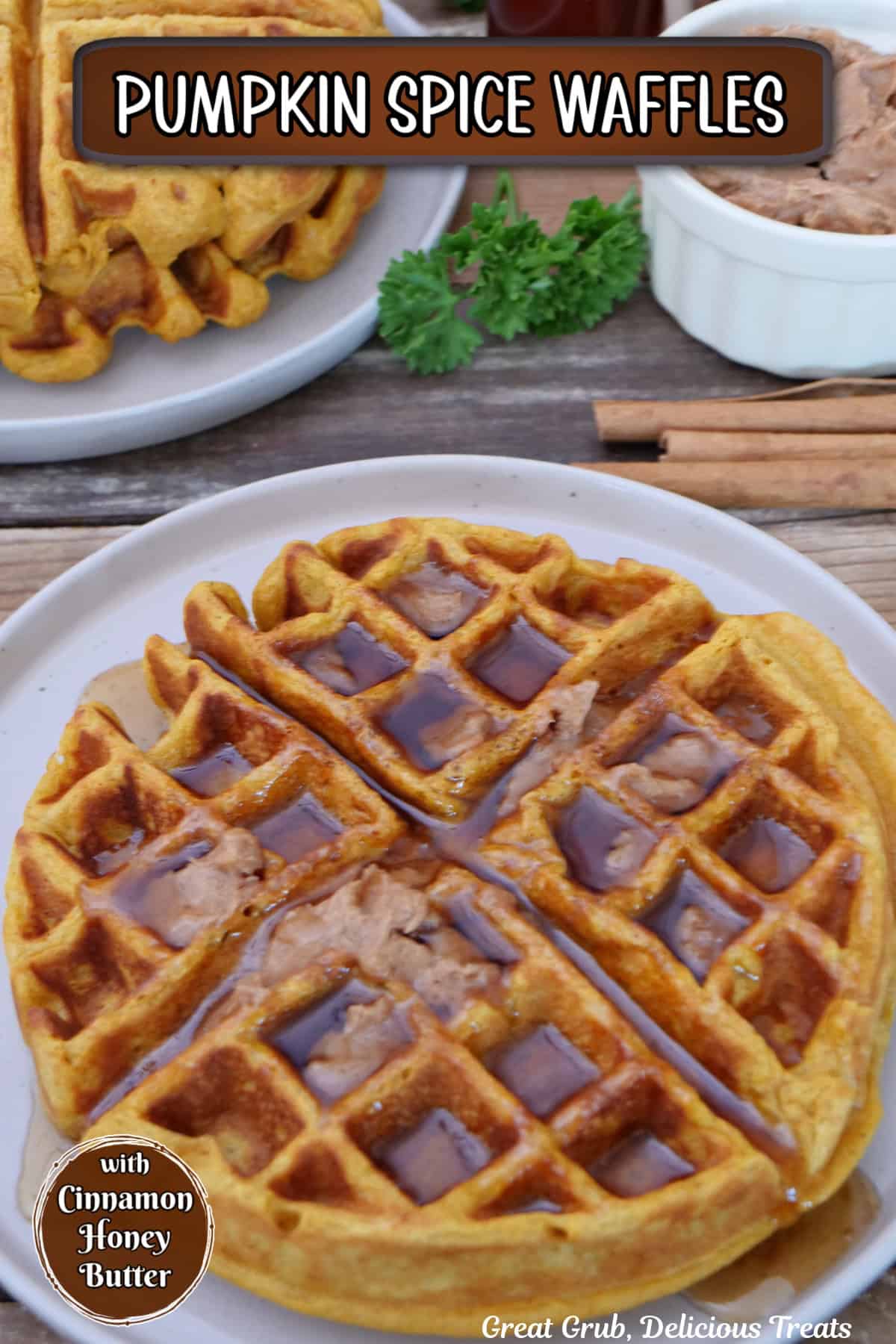 A white plate with a large pumpkin spice waffle on it with cinnamon honey butter and maple syrup on top, and a title overlay at the top.