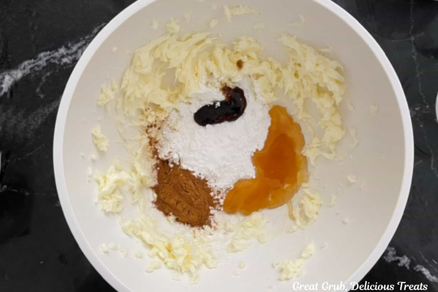 A white bowl with the cinnamon honey butter ingredients in it before being mixed together.