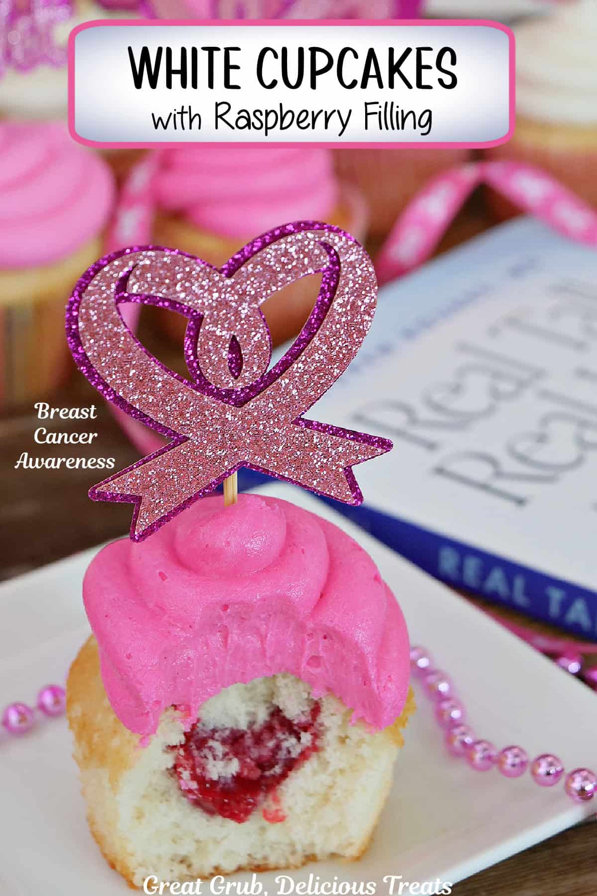 A small white square plate with a white cupcake with raspberry filling on it with a bite taken out, with a pink heart topper on the cupcake, and a title overlay at the top.