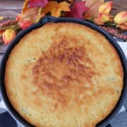 A black and white placemat with jalapeno cornbread in a round cast iron skillet, and a title overlay at the top.