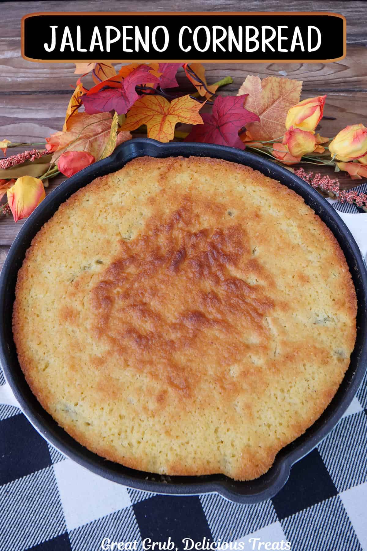 A black and white placemat with jalapeno cornbread in a round cast iron skillet, and a title overlay at the top.